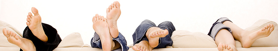 Family feet walking on grass